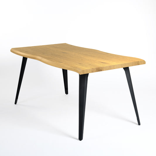 Studio product shot of the Lancelot live-edge oak dining table.